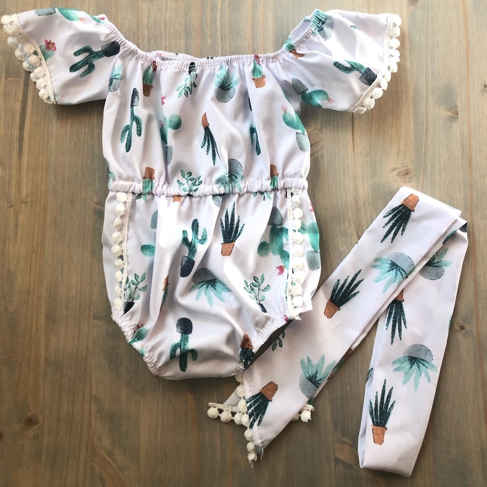 A newborn cactus baby onesie